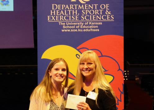 Alden Pennington receives Don Henry Health Education Award with Dr. Susan Harvey